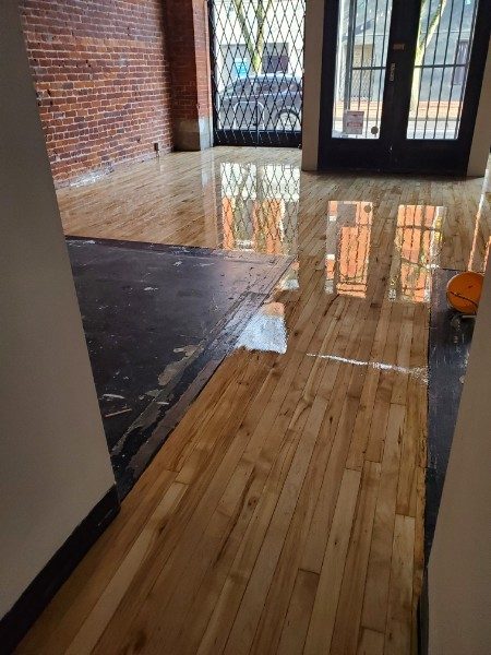 Glossy old-growth maple floor in an Old Town Portland commercial space
